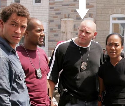 Baltimore's finest fictional cops. Carver's incompetent bald partner is indicated.